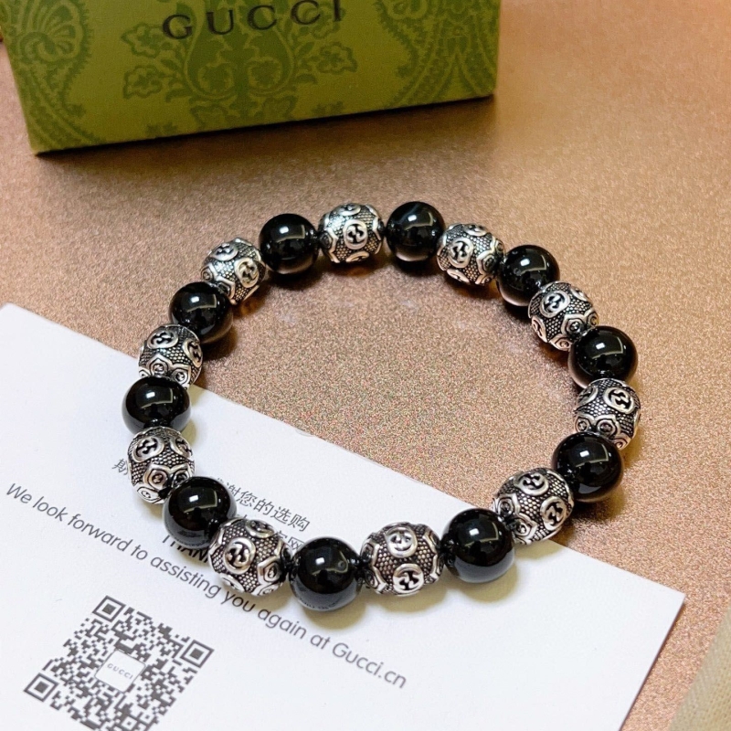 G*u*i bracelets